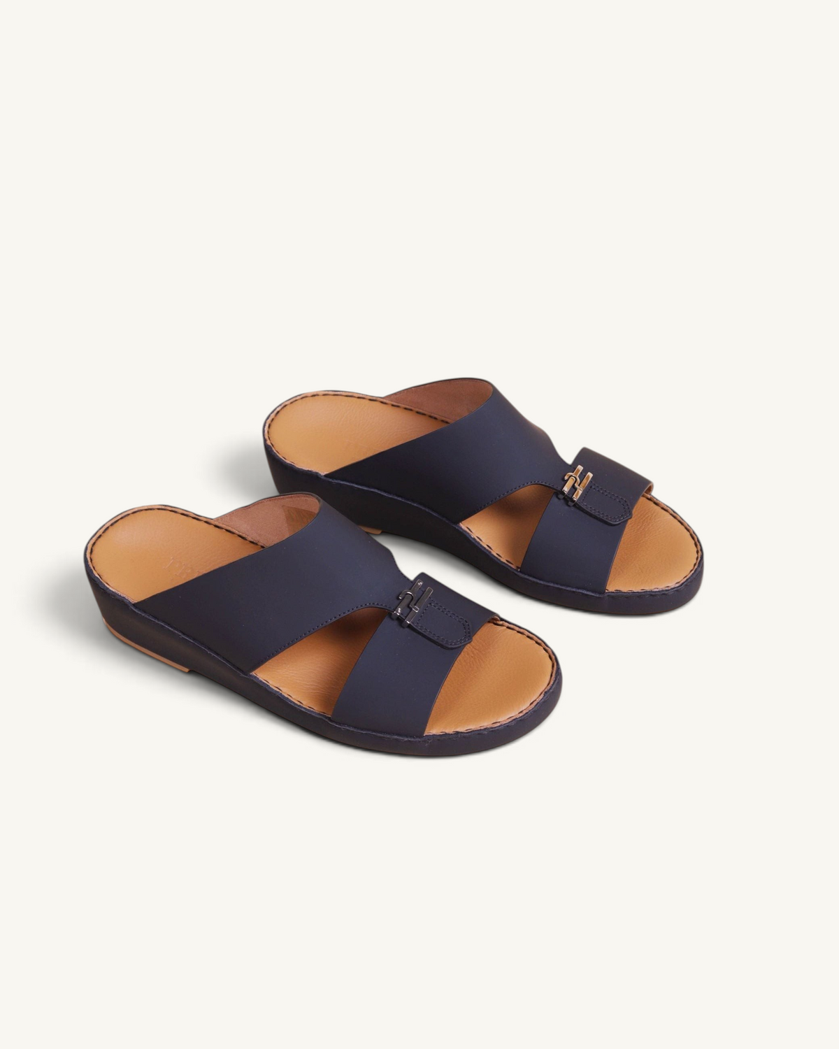 Prestige men's classic Cresset sandals in matte black leather with a gold-tone metal detail on a tan footbed
