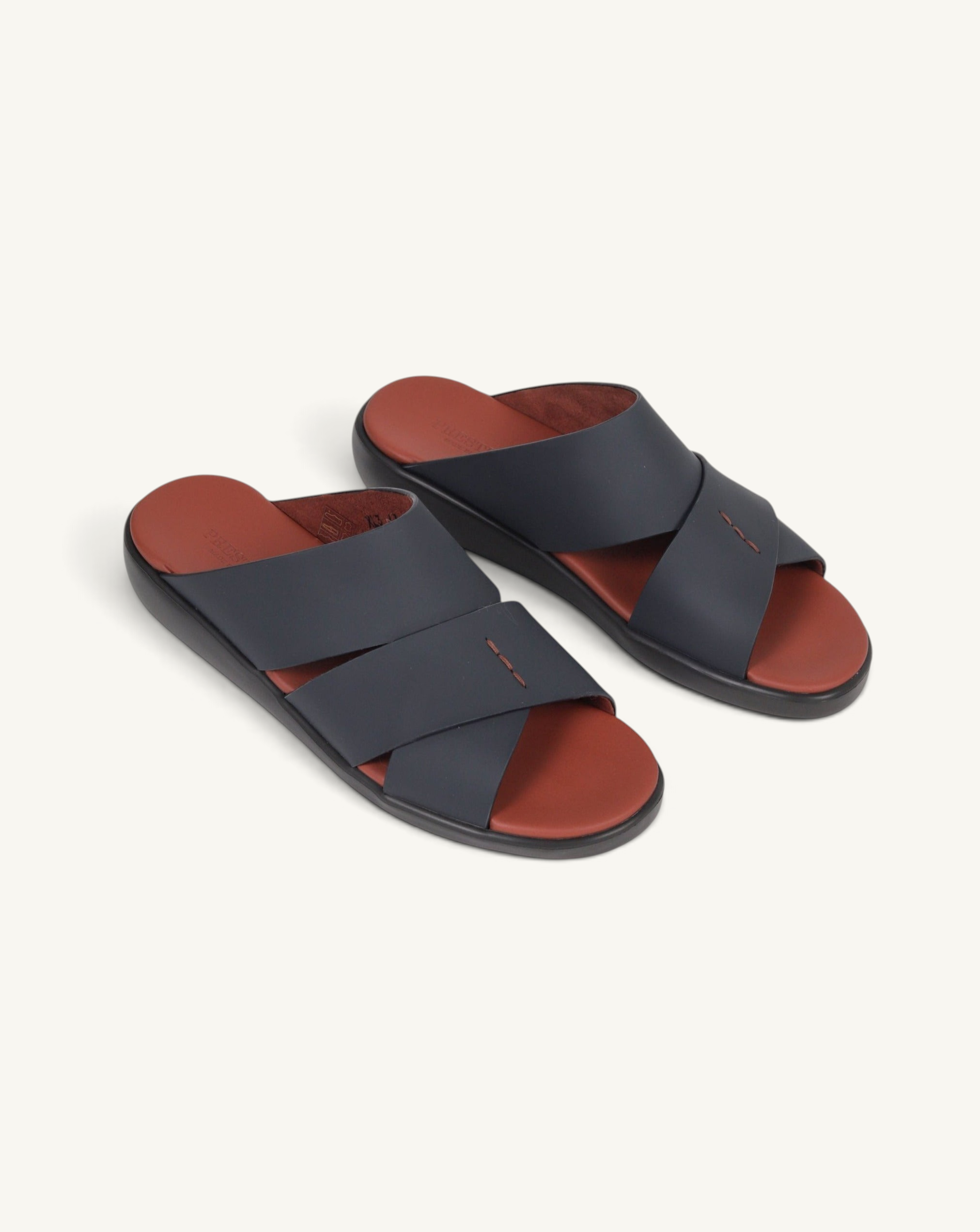 Prestige PG-XL3 slide sandals in dark blue gommato leather with a contrasting terracotta footbed and cross straps.