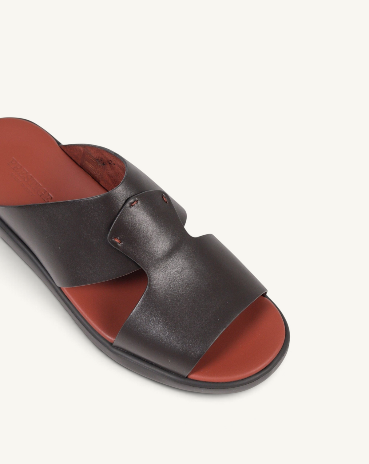 Prestige dark brown soft nappa calf leather slide sandal with a contrasting red footbed and minimalist design