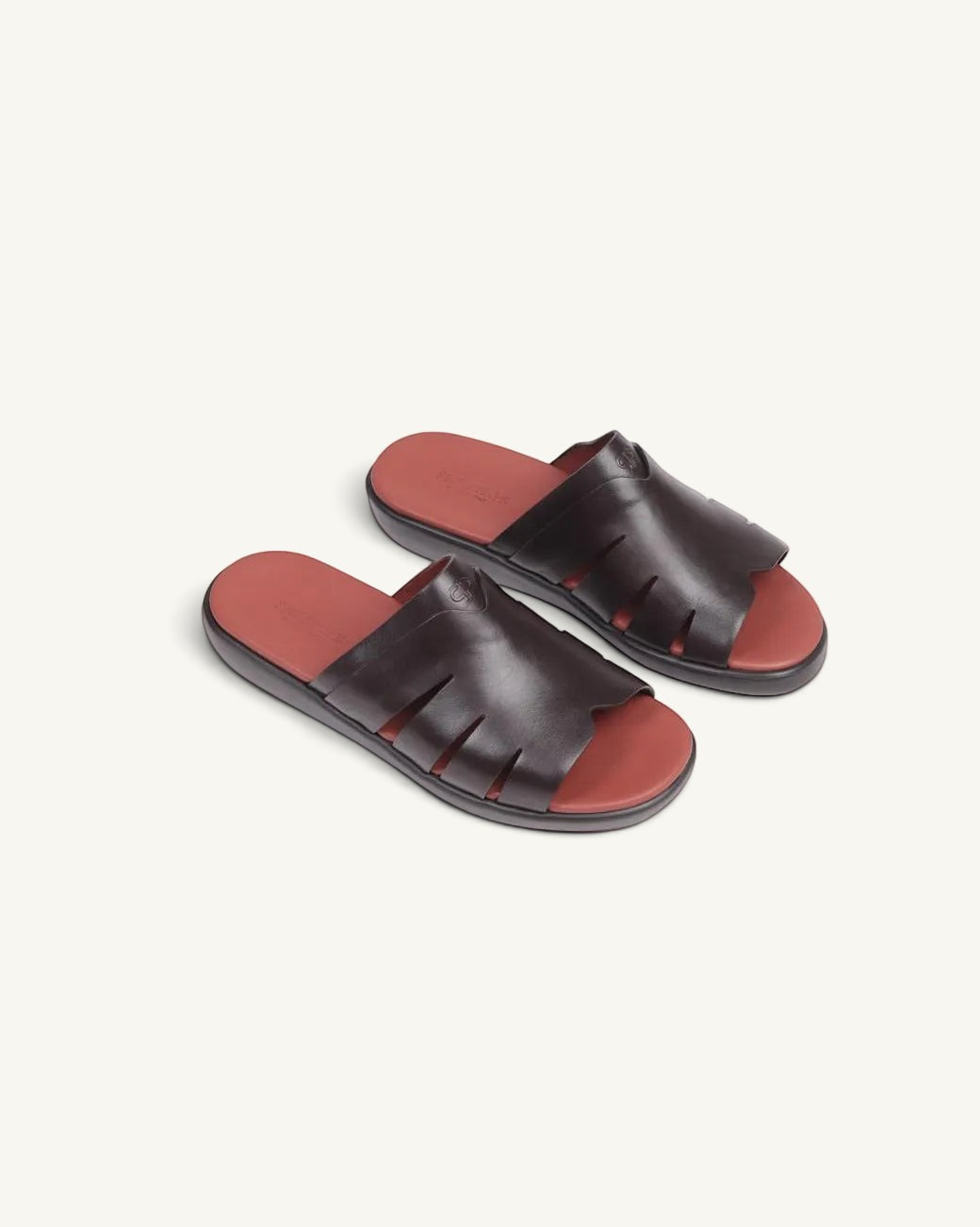 Prestige dark brown soft nappa calf leather slide sandals with a contrasting red footbed and cutout design.