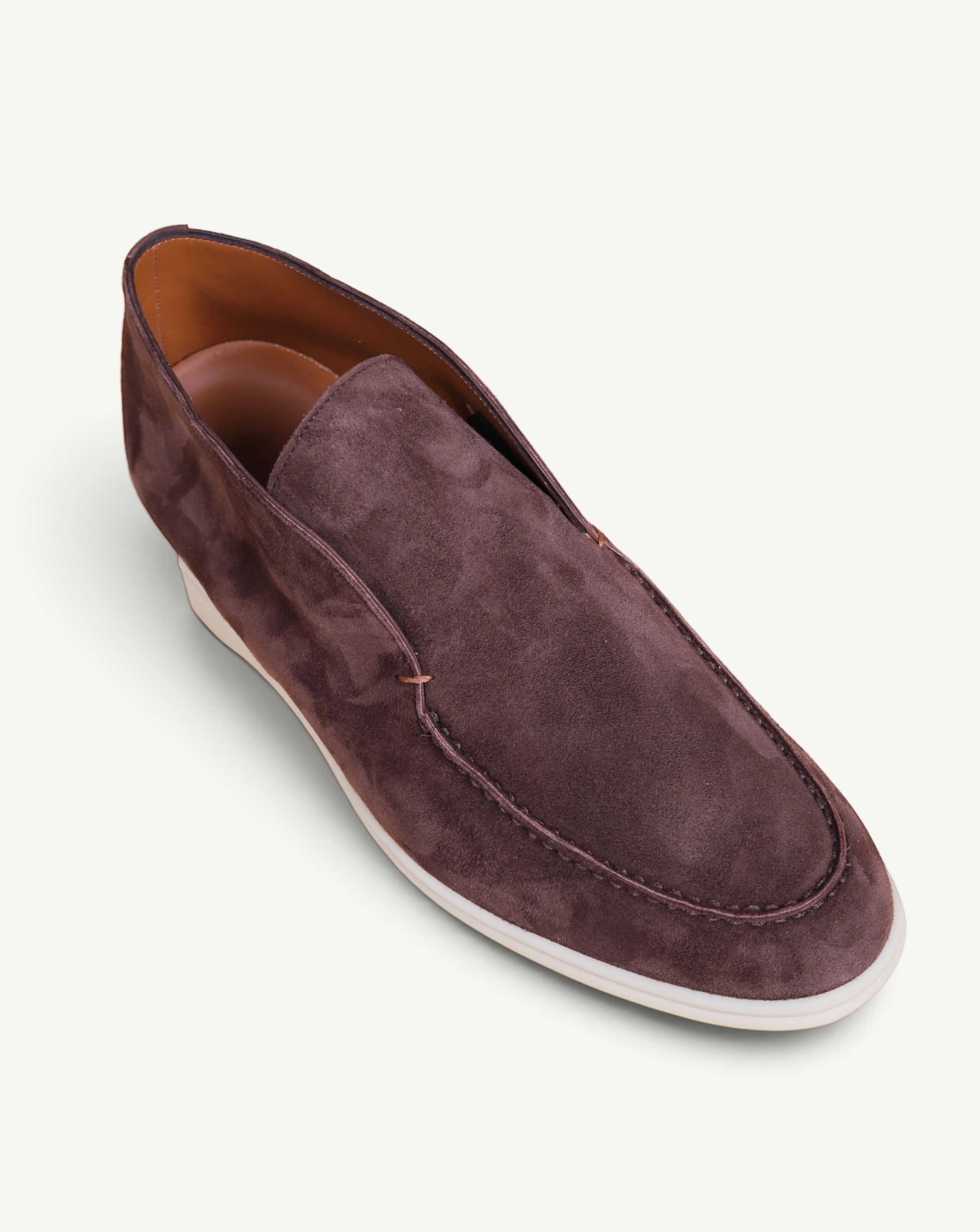 Prestige dark brown suede ankle boot with a slip-on design and a contrasting white rubber sole.