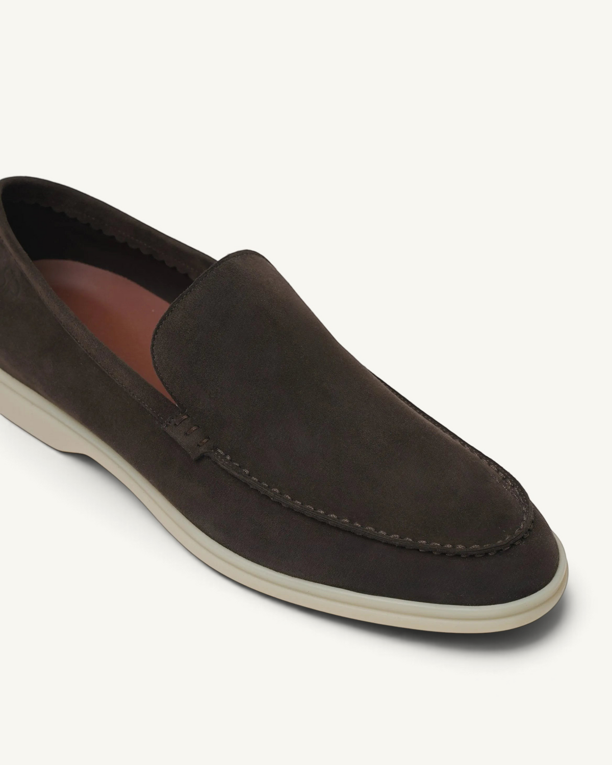 Prestige dark brown suede loafer with a clean moccasin-style stitch and a contrasting light-colored rubber sole.