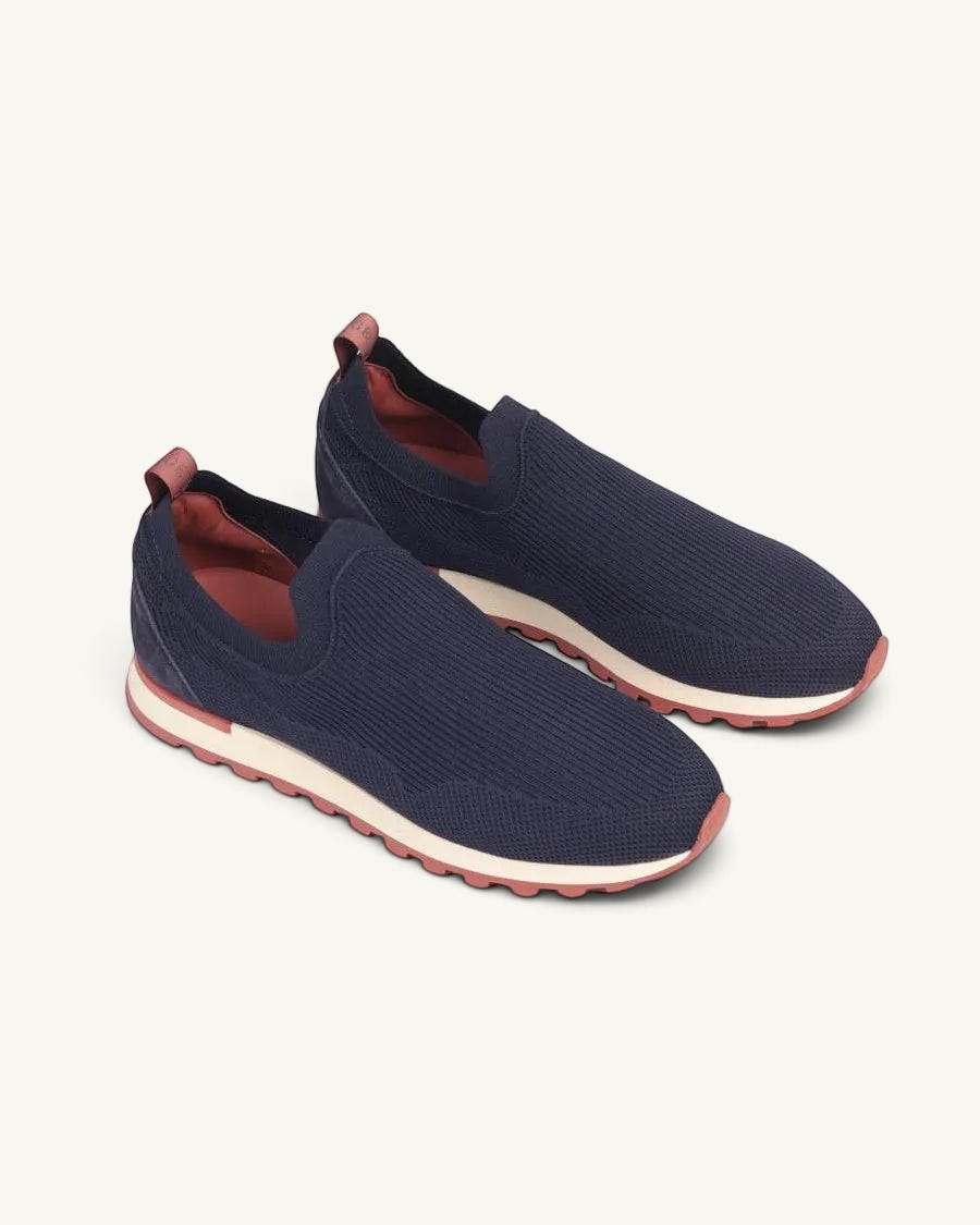 Prestige Flexy Lux active runners in navy blue knit fabric with a contrasting cream midsole and pinkish-red outsole.