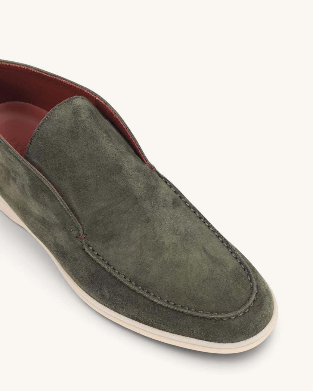 Prestige green suede ankle boot with a slip-on design and contrast stitching, shown from a top-down angle.