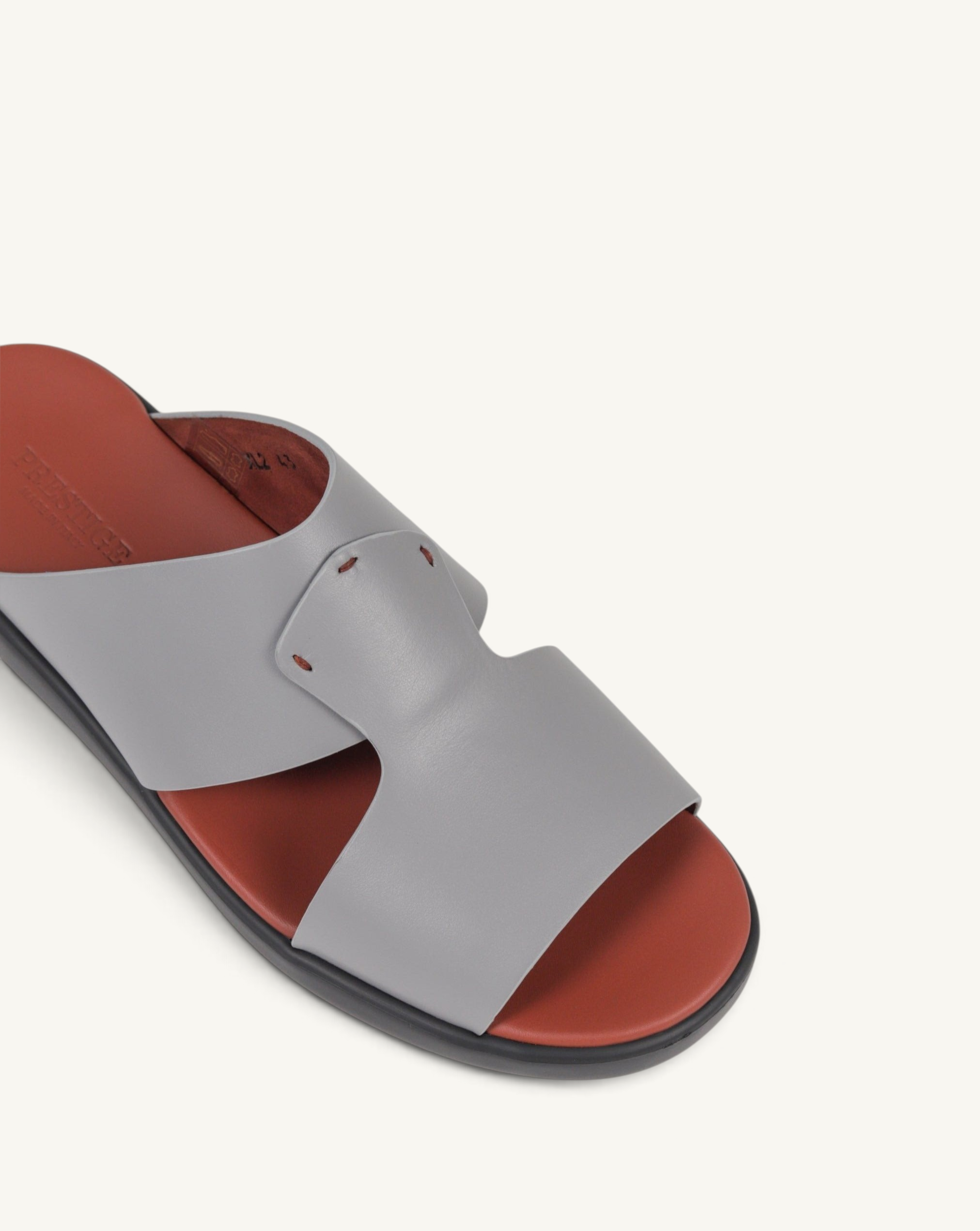 Prestige grey soft nappa calf leather slide sandal with a contrasting rust-coloured footbed
