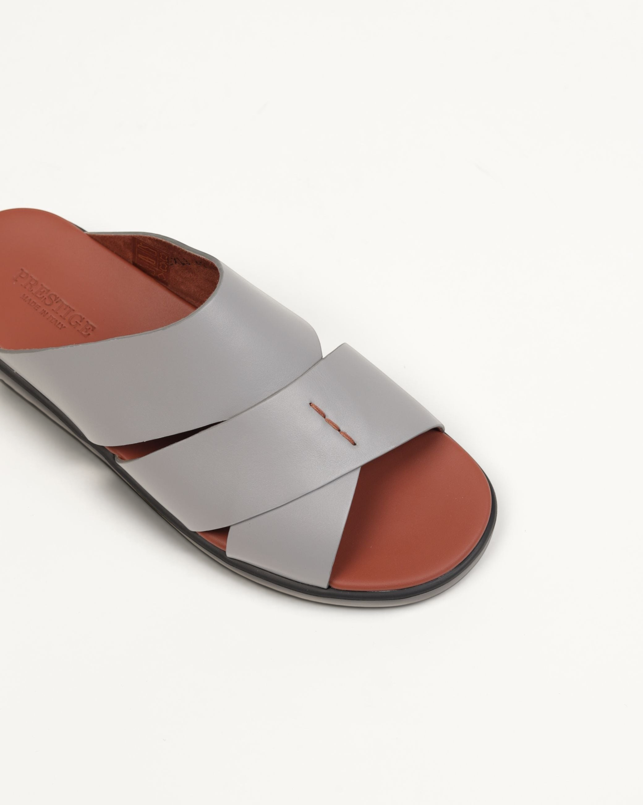 Prestige men's extra light sandals in grey soft nappa leather with a brown footbed and crisscross strap design.