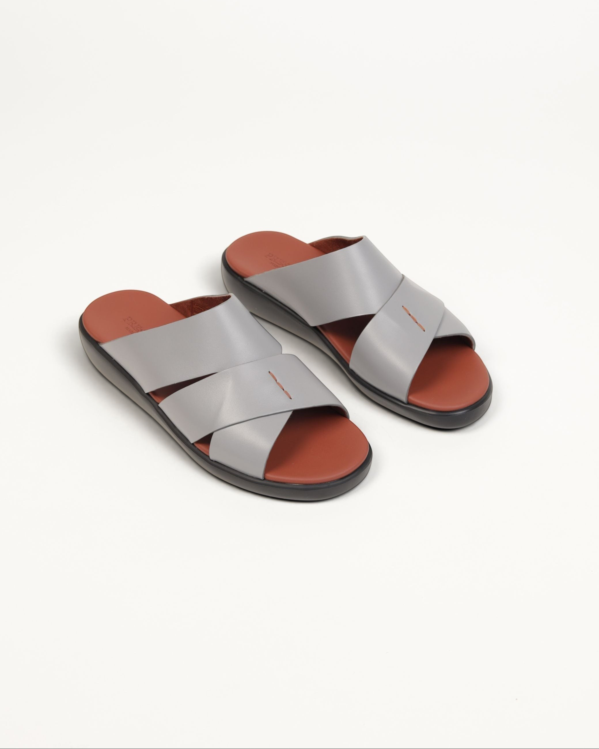 Prestige men's extra light sandals in soft grey nappa leather with a brown footbed and crisscross strap design.