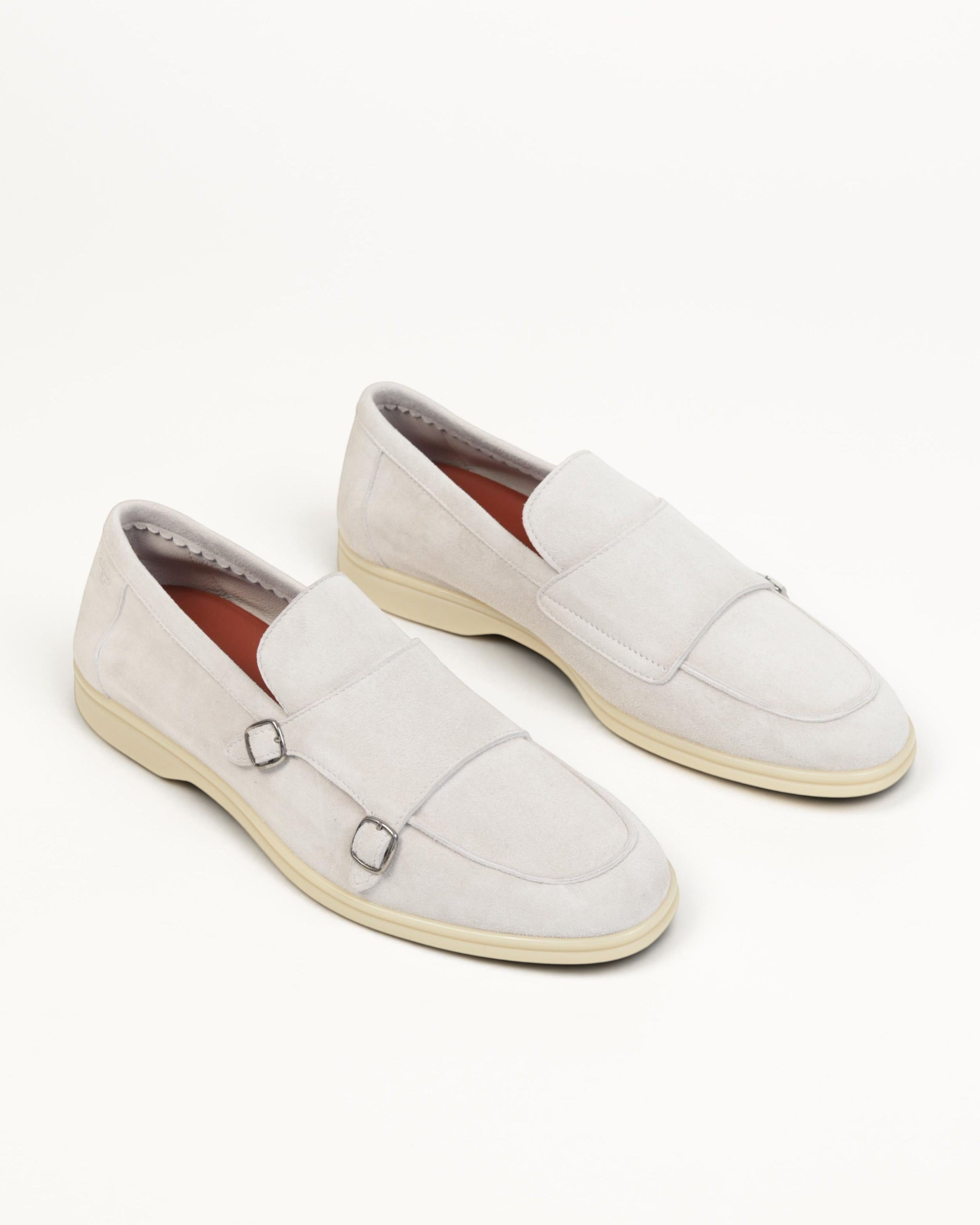 Prestige grey velour suede monk strap loafers with double silver buckles and a light beige rubber sole.