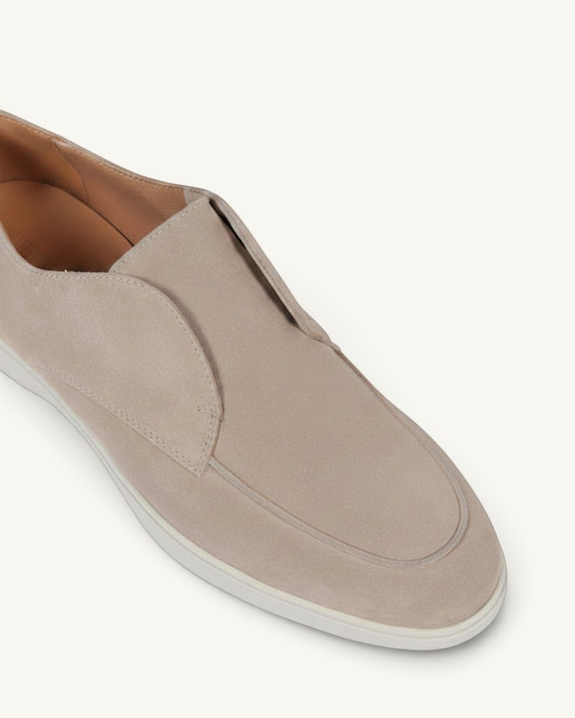 Prestige ivory velour loafers with a sleek slip-on design and minimalist aesthetic