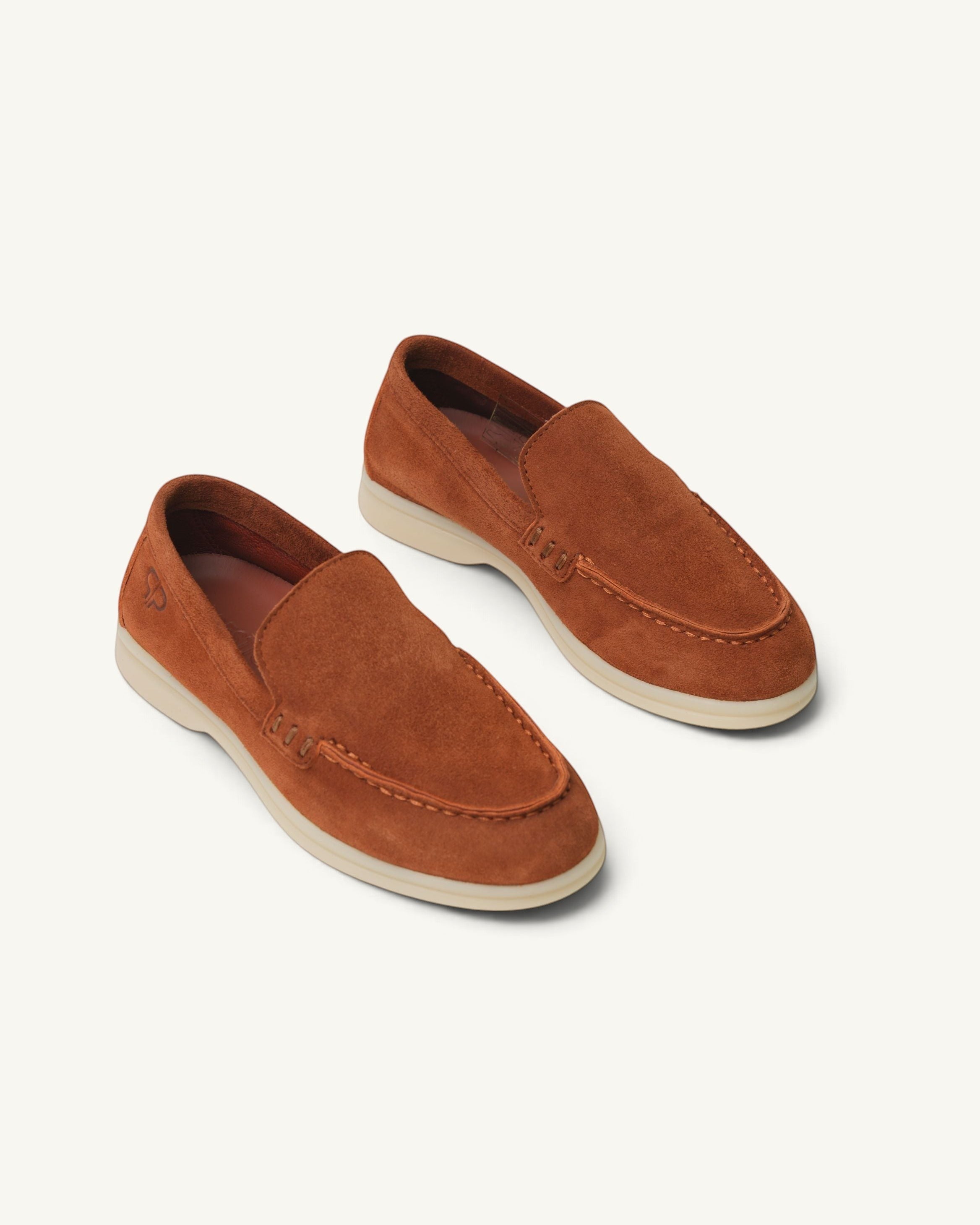 Prestige kids unisex suede loafers in brown with a comfortable rubber sole and embossed logo detail