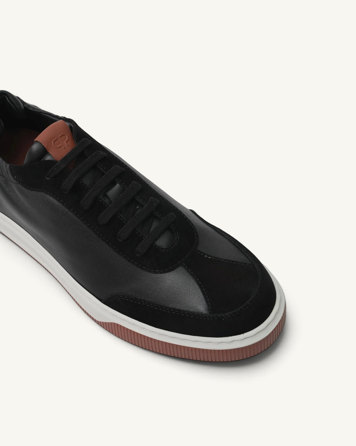 Prestige Legacy Walk Reverse men's black leather and suede sneaker with a brown tongue patch and white rubber sole.