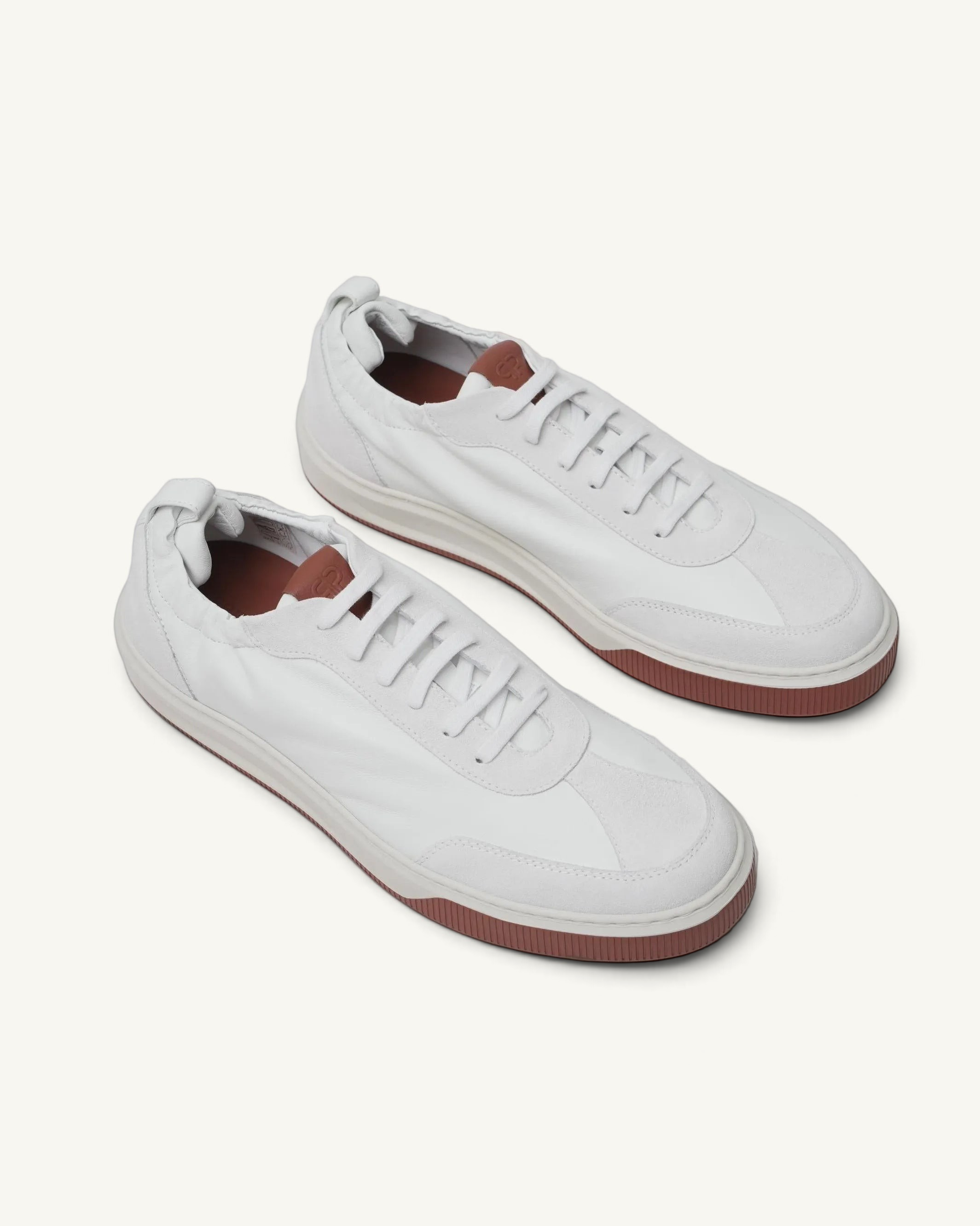 Prestige Legacy Walk Reverse men's sneakers in white leather with a contrasting brown rubber sole and lace-up design.