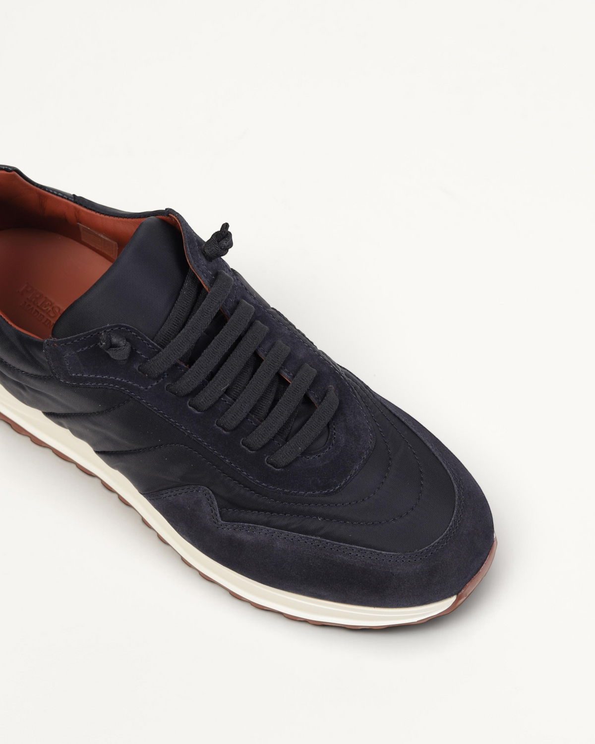 Prestige XLR Weekend Walk luxury blue sneakers featuring a mix of suede and technical fabric with a white sole.