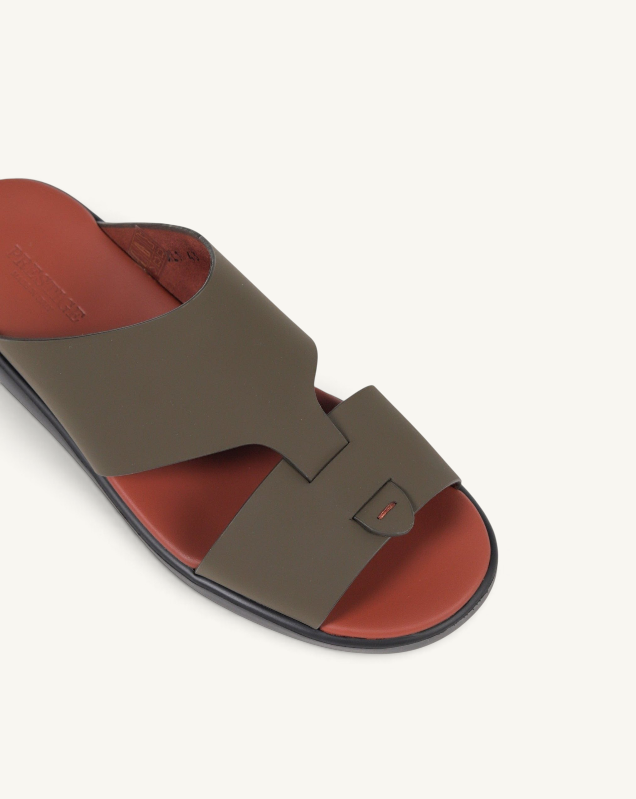 Prestige PG-XL1 Gommato military green slide sandals with a rust-coloured footbed and minimalist cutout design.