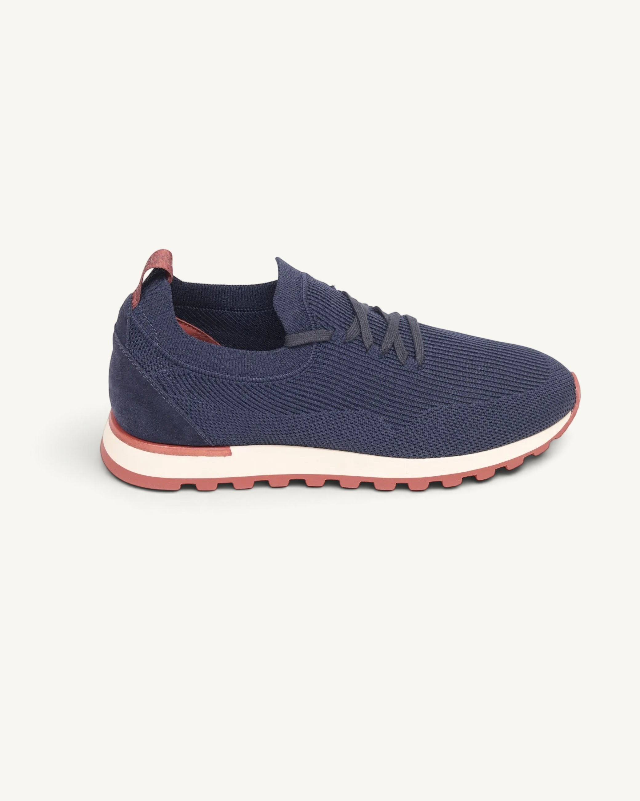 Prestige navy blue Flexy Lux runner sneakers with a knitted upper, suede heel detail, and a white and red sole.