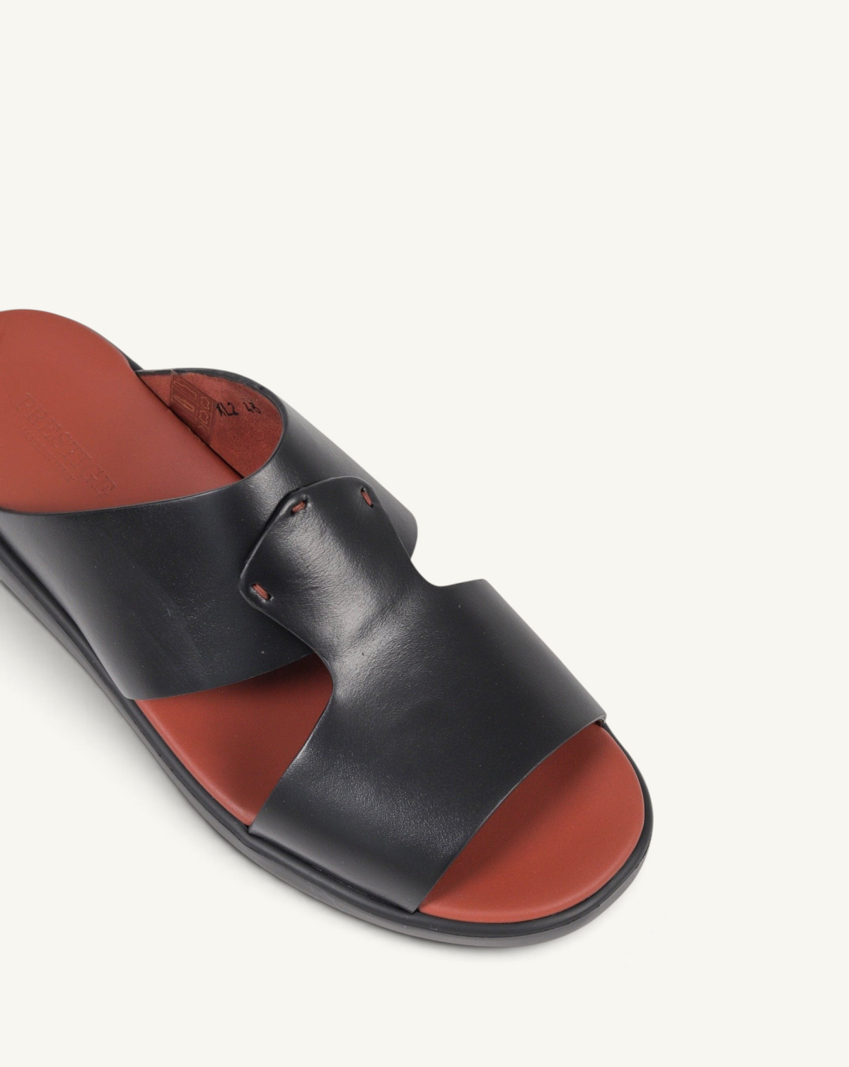 Prestige PG-XL2 Gommato black leather slide sandals with a contrasting terracotta footbed and wide strap design.