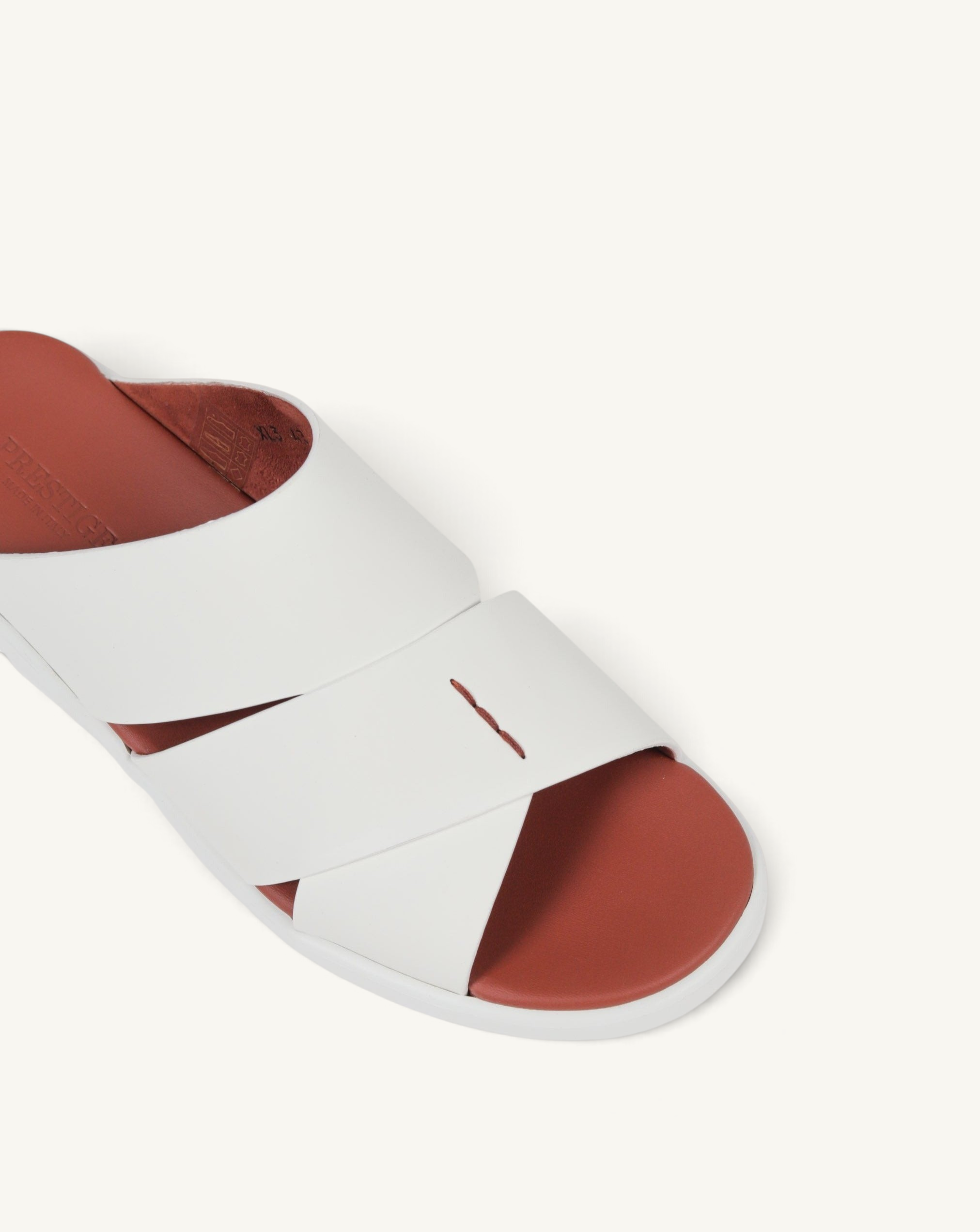 Prestige PG-XL3 slide sandals featuring white leather crisscross straps and a contrasting terracotta footbed.