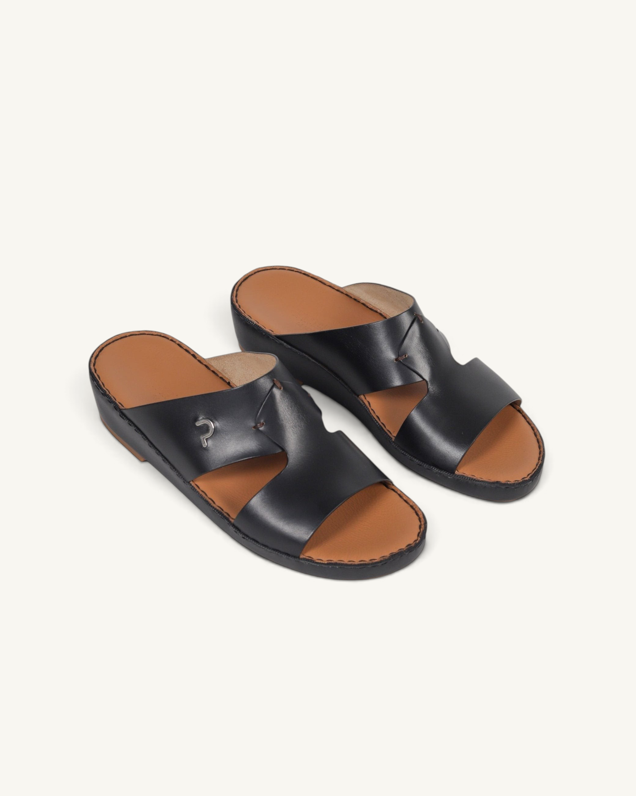 Prestige P3345 Phantom NC black leather slide sandals with a tan footbed and metallic logo detail