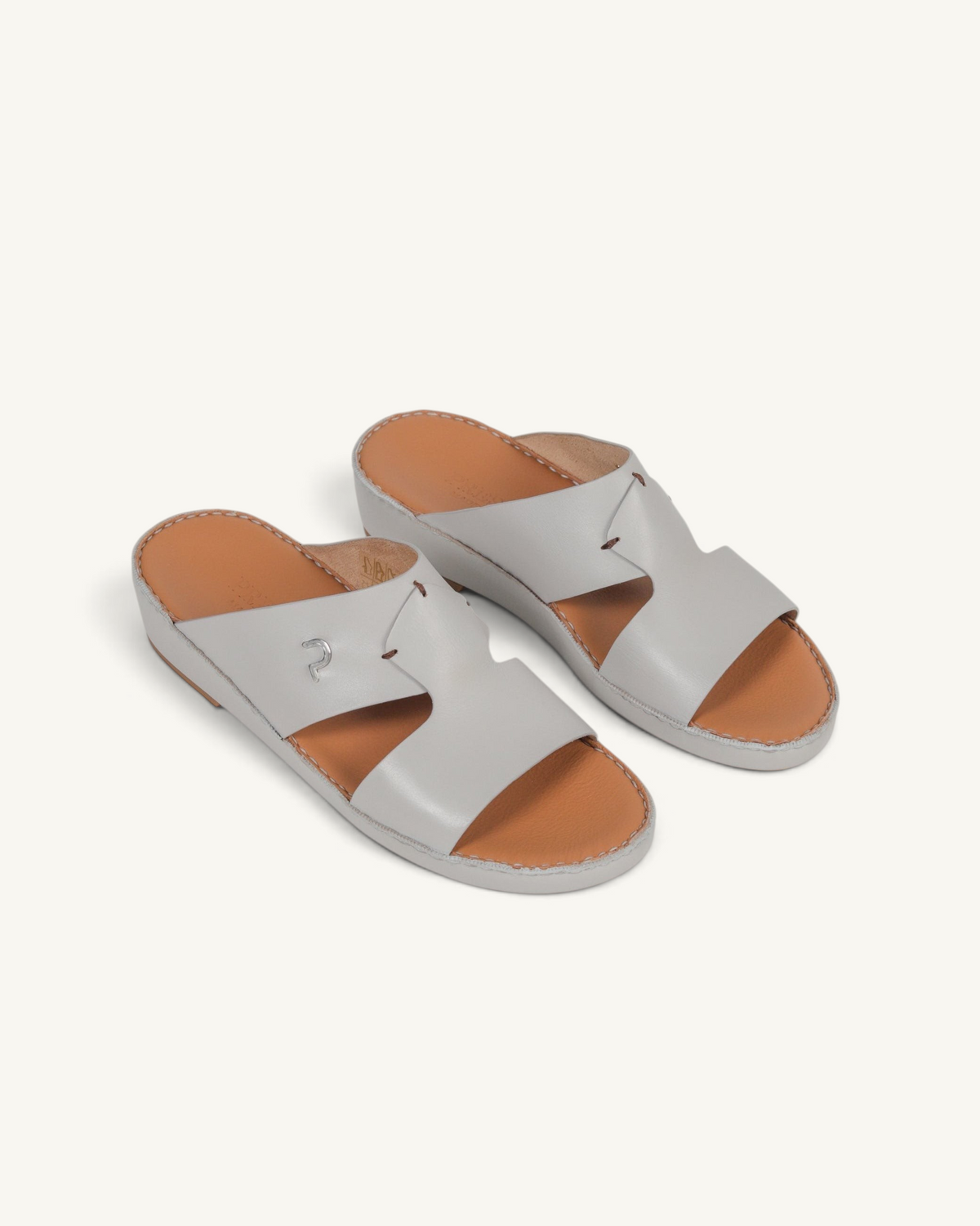 Prestige P3345 Phantom NC Perla slide sandals in light grey leather with a tan footbed and silver logo detail.