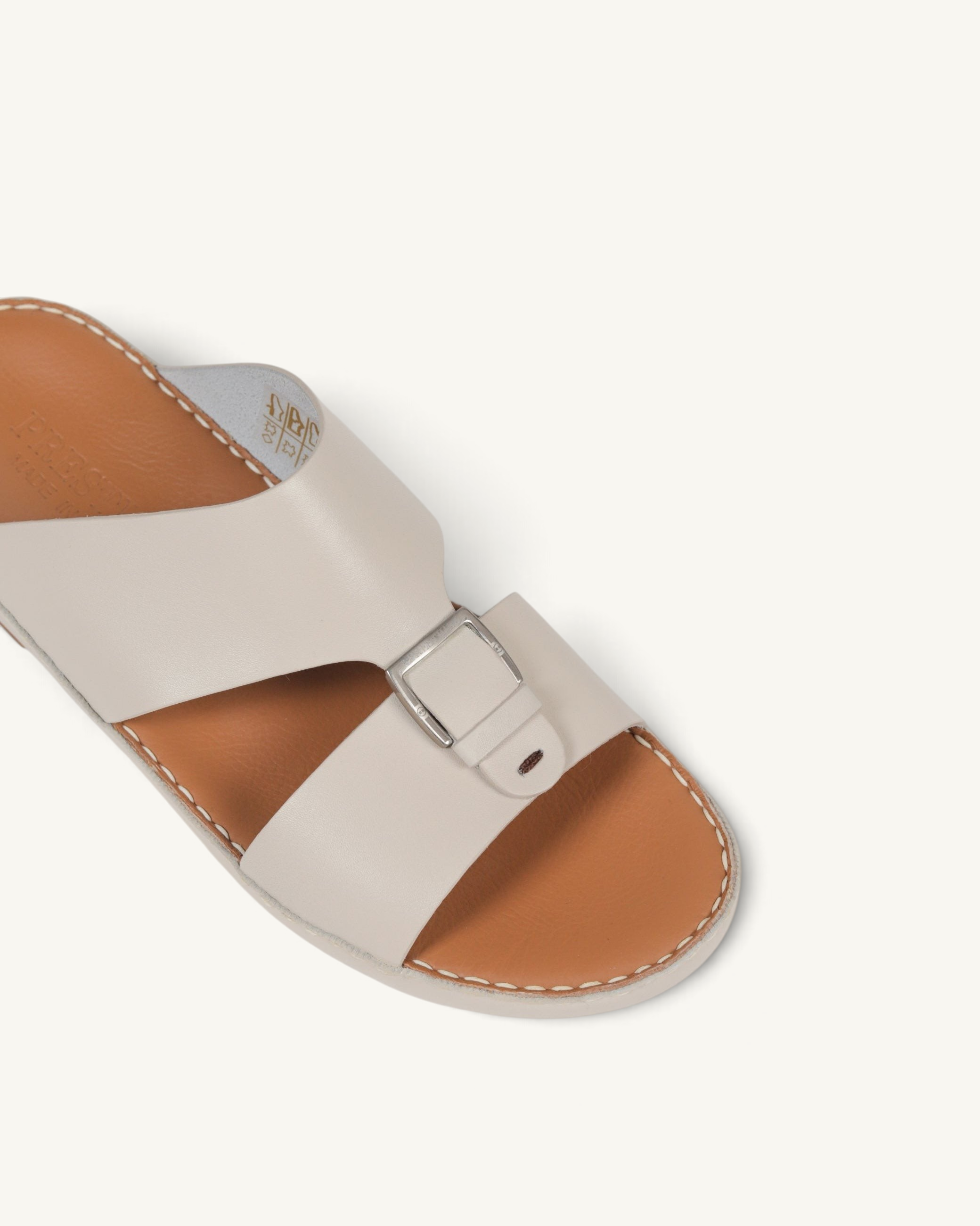 Prestige P3344 Phantom NC milk leather slide sandal with a silver buckle and tan footbed