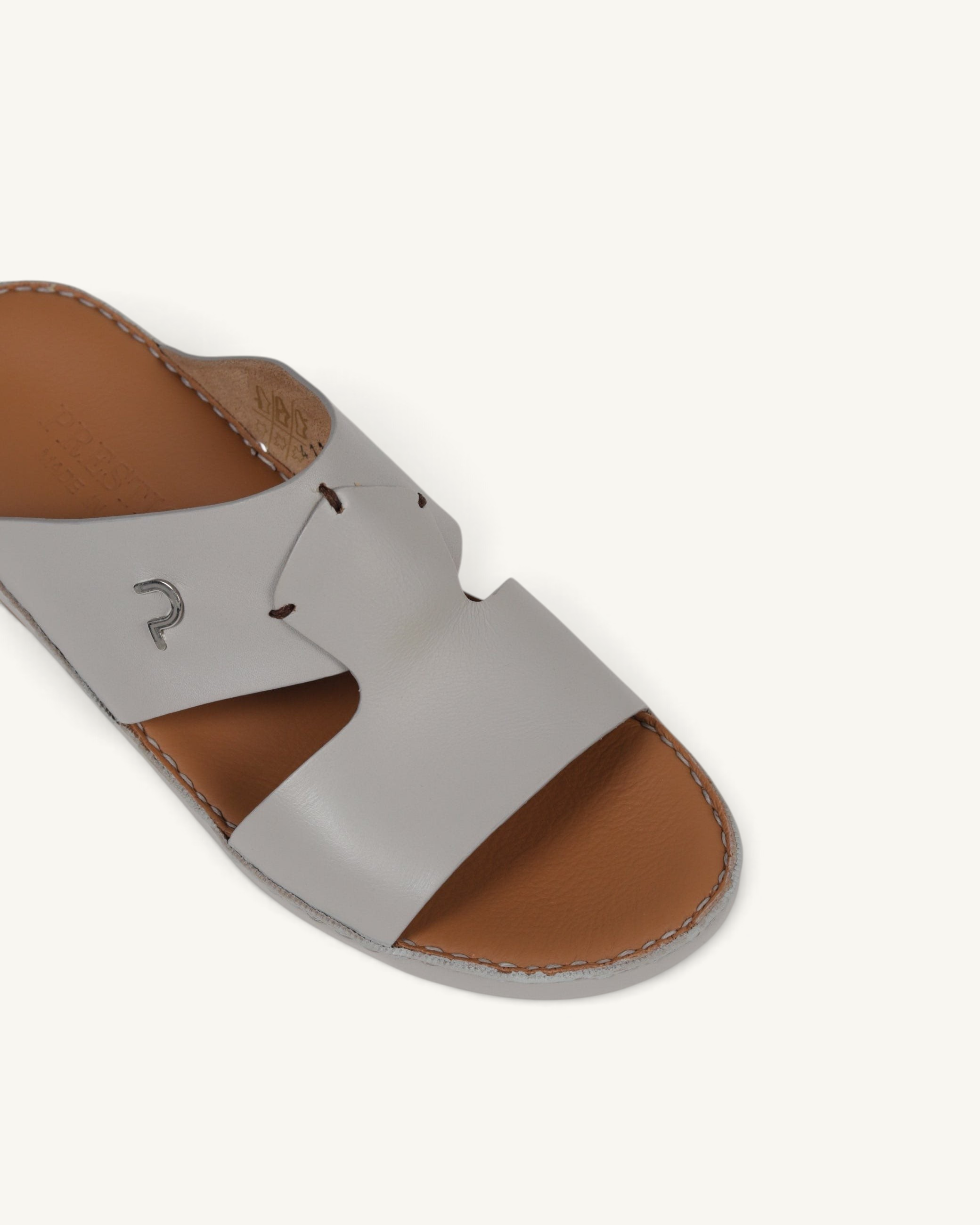 Prestige P3345 Phantom NC Perla leather sandal in light grey with a tan footbed and metallic logo detail.