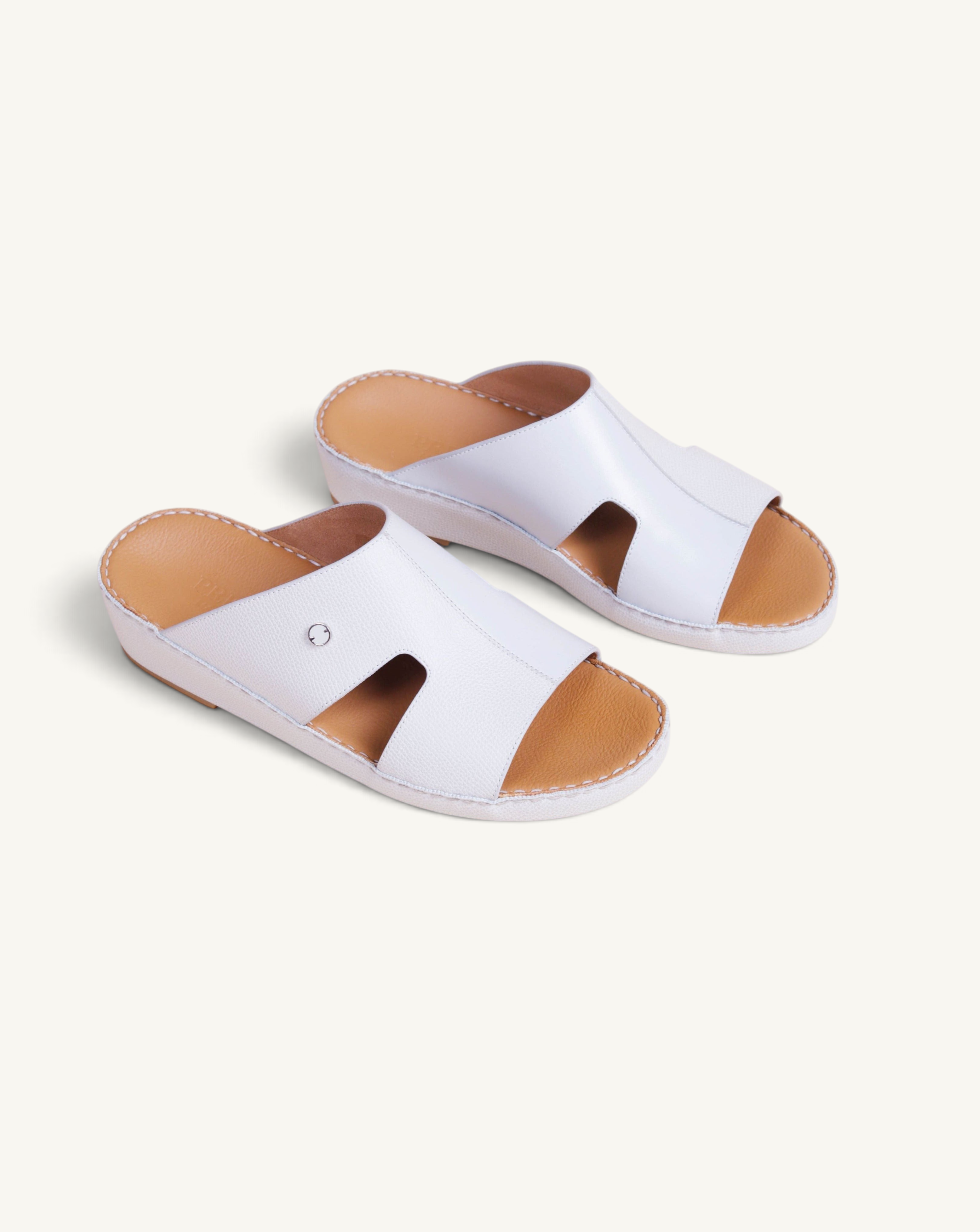 Prestige Portofino Goteborg slide sandals in white nappa leather with a tan footbed and cutout side detail.