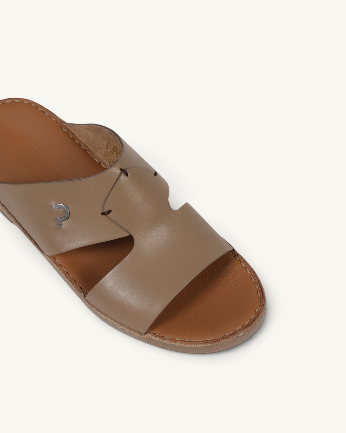 Prestige P3345 Phantom NC Sharon slide sandal in taupe leather with a silver logo detail and stitched footbed
