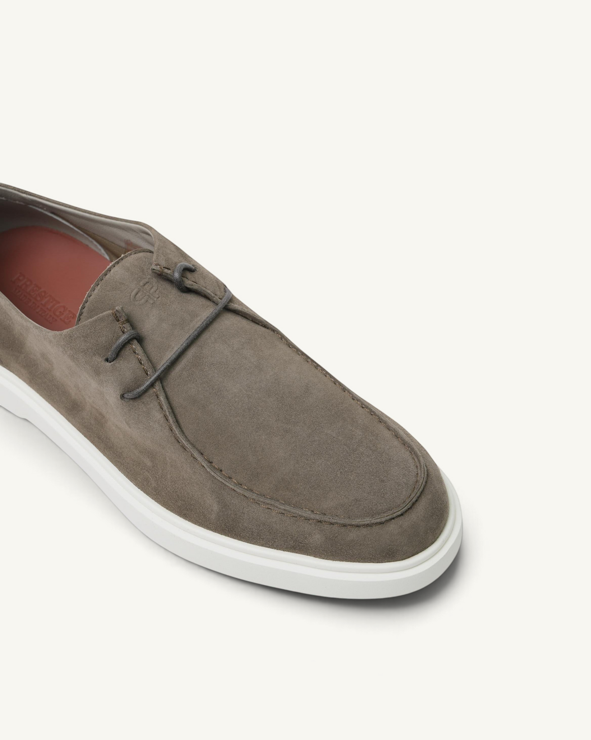 Prestige Playtime Reverse men's loafer in taupe suede with a white rubber sole and lace-up detail